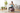 Beginner woman doing seated core exercise on Trideer mauve exercise ball in bright home gym