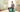 Pregnant woman sitting on Trideer teal birthing ball in a cozy nursery