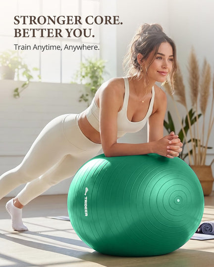Woman performing a forearm plank on a green Trideer exercise ball at home.