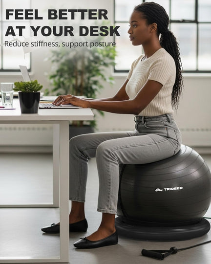 Woman working on a laptop while seated on a black Trideer ball chair with ring base