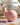 Pink Trideer mini Pilates ball on a yoga mat in a home workout space