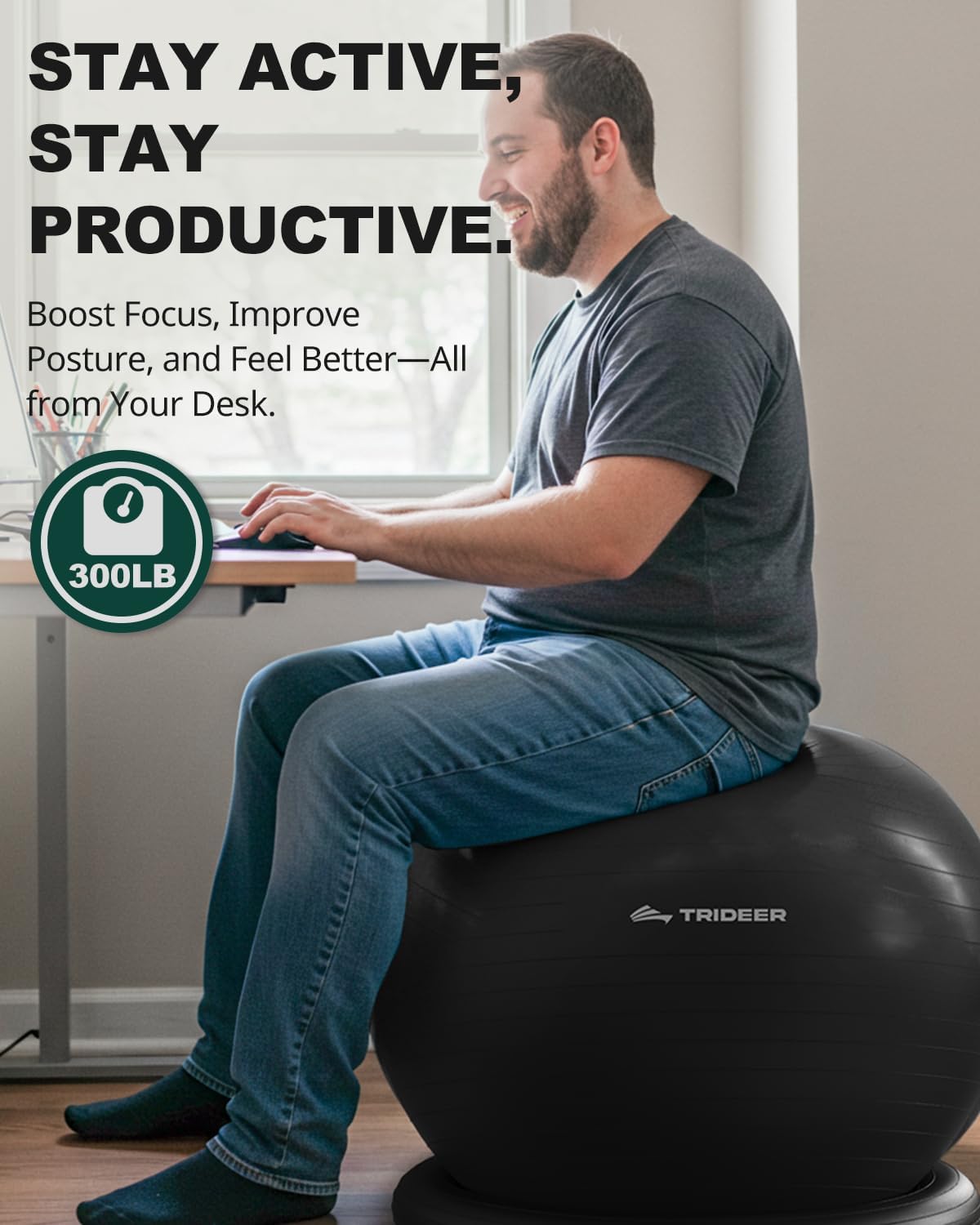Man working at a desk while seated on a black Trideer exercise ball chair