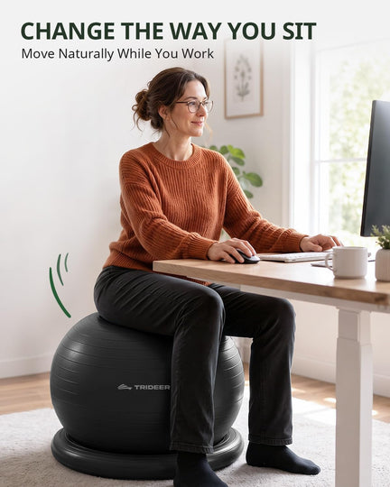 Woman using exercise ball chair at office desk for better posture