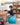Boy writing at a desk while sitting on a blue Trideer kids yoga ball chair with flexible feet.