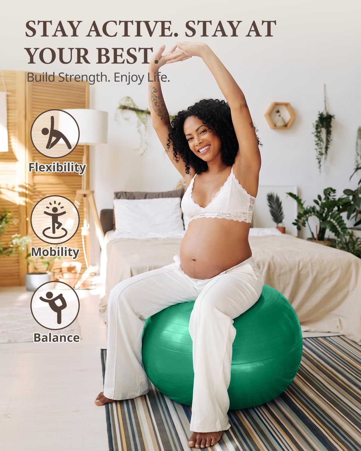 Pregnant woman stretching her arms overhead while seated on a green Trideer exercise ball.