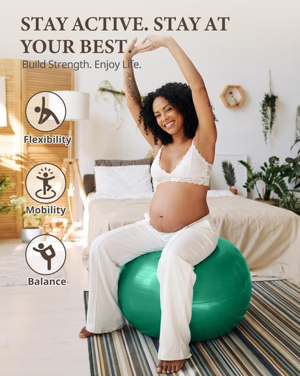 Pregnant woman stretching her arms overhead while seated on a green Trideer exercise ball.