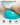 Close-up of a turquoise Trideer mini Pilates ball supporting the lower back, with surface texture highlighted.