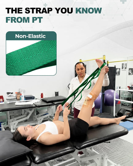 Woman lying on a treatment table using a green stretching strap for a raised-leg stretch with assistance.