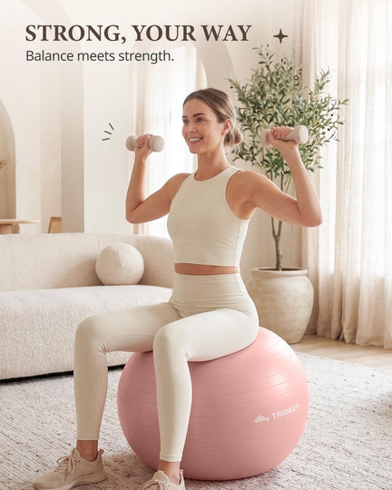 Woman exercising with dumbbells while seated on a pink Trideer exercise ball at home.