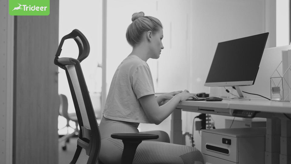 Woman using Trideer ball chair at office desk for back pain relief