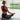 Woman using sustainable cork yoga blocks for yoga pose alignment and support