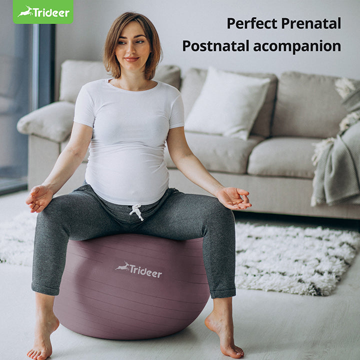 Pregnant woman using birthing ball for pregnancy exercises and labor preparation